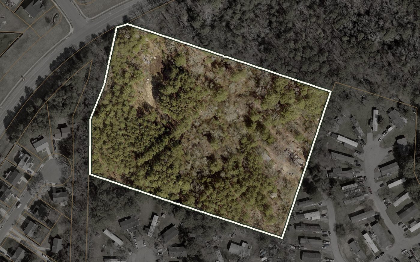 Aerial view of the wooded RiverSouth site in Lexington Park, outlined against the neighbouring streets on either side